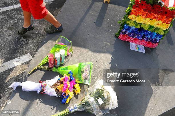 Flowers for the victims of the Pulse Nightclub shooting lay at the front of the nightclub on June 21, 2016 in Orlando, Florida. Orlando community...