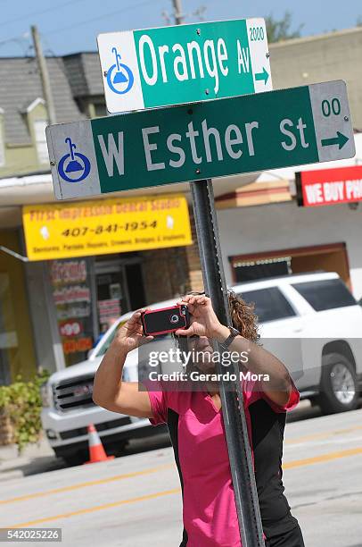 Woman takes pictures at the exterior of the Pulse Nightclub building on June 21, 2016 in Orlando, Florida. The Orlando community continues to mourn...