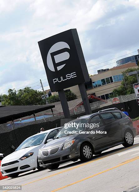 Vehicles cross in front of the Pulse Nightclub on June 21, 2016 in Orlando, Florida. Orlando community continues to mourn deadly mass shooting at gay...