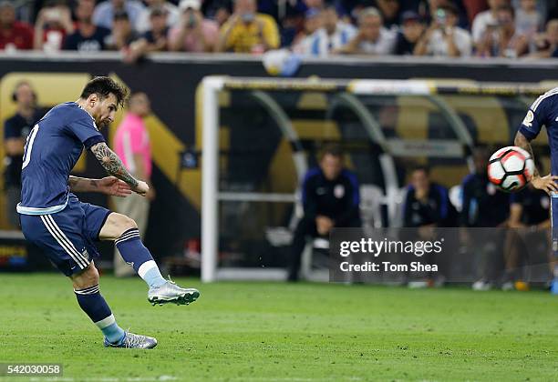 Lionel Messi of Argentina takes a free kick to score the second goal of his team during the Semifinal match between United States and Argentina at...