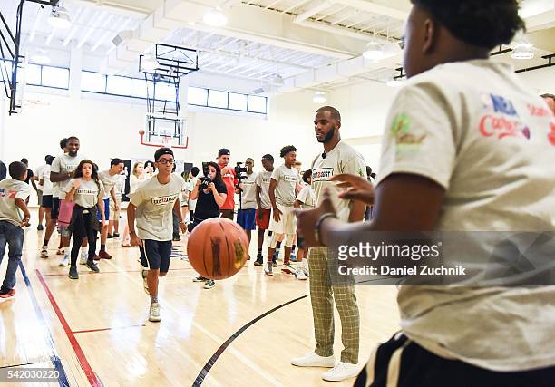 All-Star Chris Paul hosts a basketball clinic during the unveiling with NBA Cares and State Farm of NYC Assist, a Teen Learning Center at Educational...