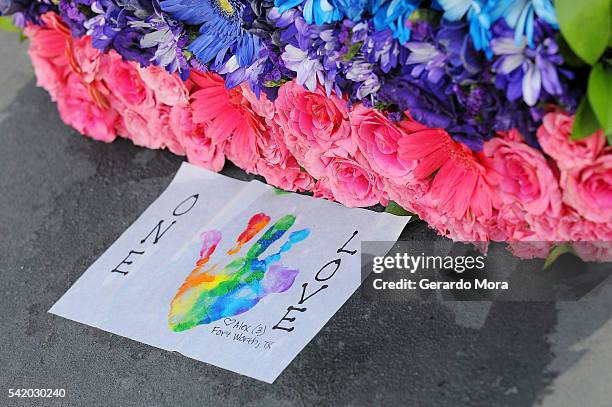 Flowers for the victims of the Pulse Nightclub shooting lie at the front of the nightclub on June 21, 2016 in Orlando, Florida. The Orlando community...