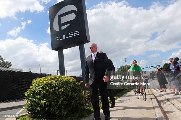 Agent Ronald Hopper walks in front of the Pulse nightclub on June 21, 2016 in Orlando, Florida. The Orlando community continues to mourn the victims...