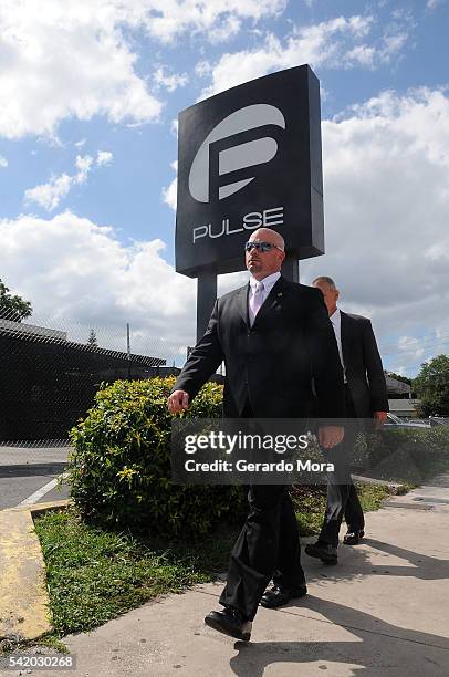 Agent Ronald Hopper walks in front of the Pulse nightclub on June 21, 2016 in Orlando, Florida. The Orlando community continues to mourn the victims...