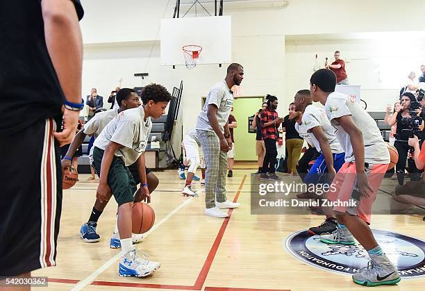 All-Star Chris Paul hosts a basketball clinic during the unveiling with NBA Cares and State Farm of NYC Assist, a Teen Learning Center at Educational...