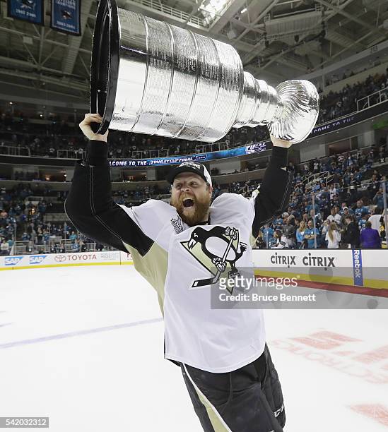 Phil Kessel of the Pittsburgh Penguins celebrates with the Stanley Cup after their 3-1 victory to win the Stanley Cup against the San Jose Sharks in...