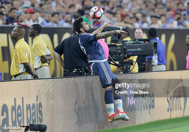 Ezequiel Lavezzi of Argentina flips over the boards while controlling the ball during the Semifinal match between United States and Argentina at NRG...