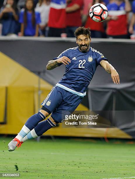 Ezequiel Lavezzi of Argentina heads the ball to score the opening goal during the Semifinal match between United States and Argentina at NRG Stadium...