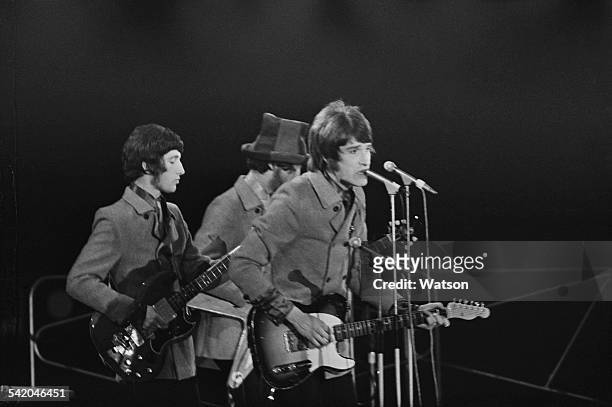 English rock band The Kinks perform as part of the 'Daily Express Record Star Show' being held at the Empire Pool & Sports Arena, Wembley, London,...