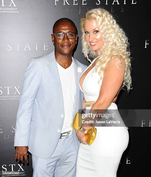 Actor Tommy Davidson and wife Amanda Moore attend the premiere of "Free State of Jones" at DGA Theater on June 21, 2016 in Los Angeles, California.