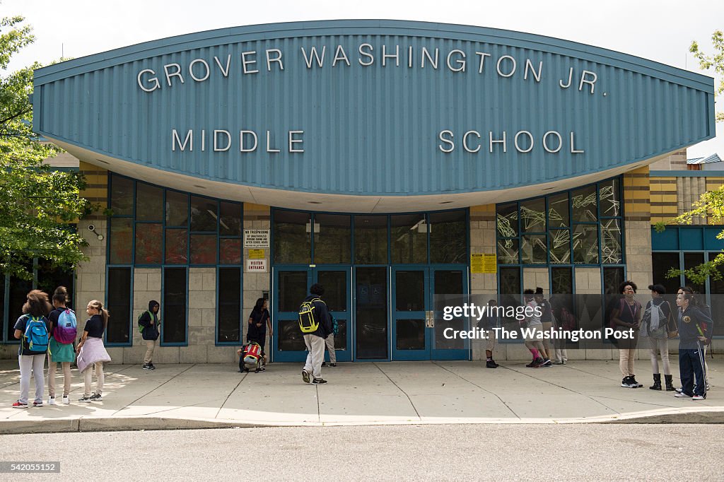 Students wait for rides after a day of classes at Grover Washington