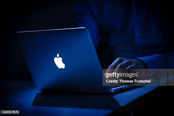 In this photo Illustration the logo of Apple lights on an Apple Macbook Air on June 22, 2016 in Berlin, Germany.