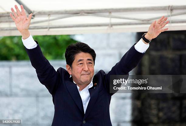 Japanese Prime Minister and Liberal Democratic Party President Shinzo Abe waves during an election campaign rally on June 22, 2016 in Koriyama,...