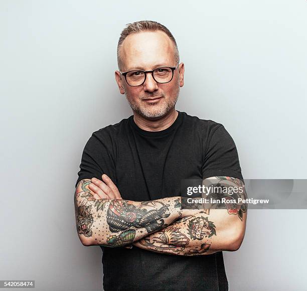 portrait of middle-aged man with arms crossed - tattoo man stock pictures, royalty-free photos & images