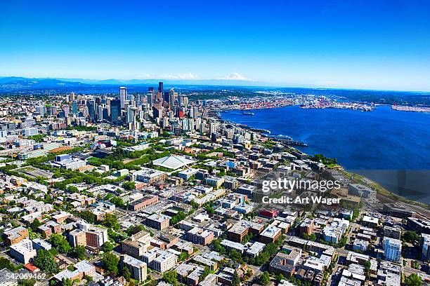 distant aerial view of the seattle skyline and metro area - puget sound stock pictures, royalty-free photos & images