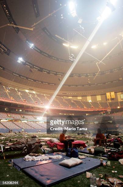 Stranded victims of Hurricane Katrina rest inside the Superdome September 2, 2005 in New Orleans. Thousands of troops poured into the city September...