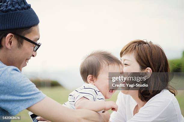 happy family with baby boy. - smiling baby stock pictures, royalty-free photos & images