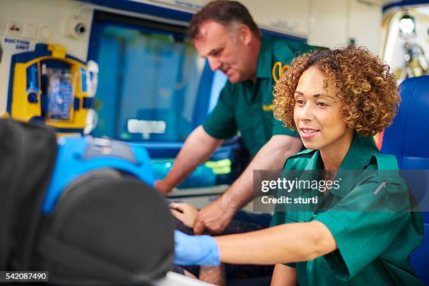 paramedics with patient - paramedic uk stock pictures, royalty-free photos & images