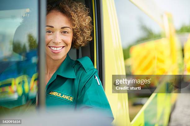 happy female paramedic - ambulance uk stock pictures, royalty-free photos & images