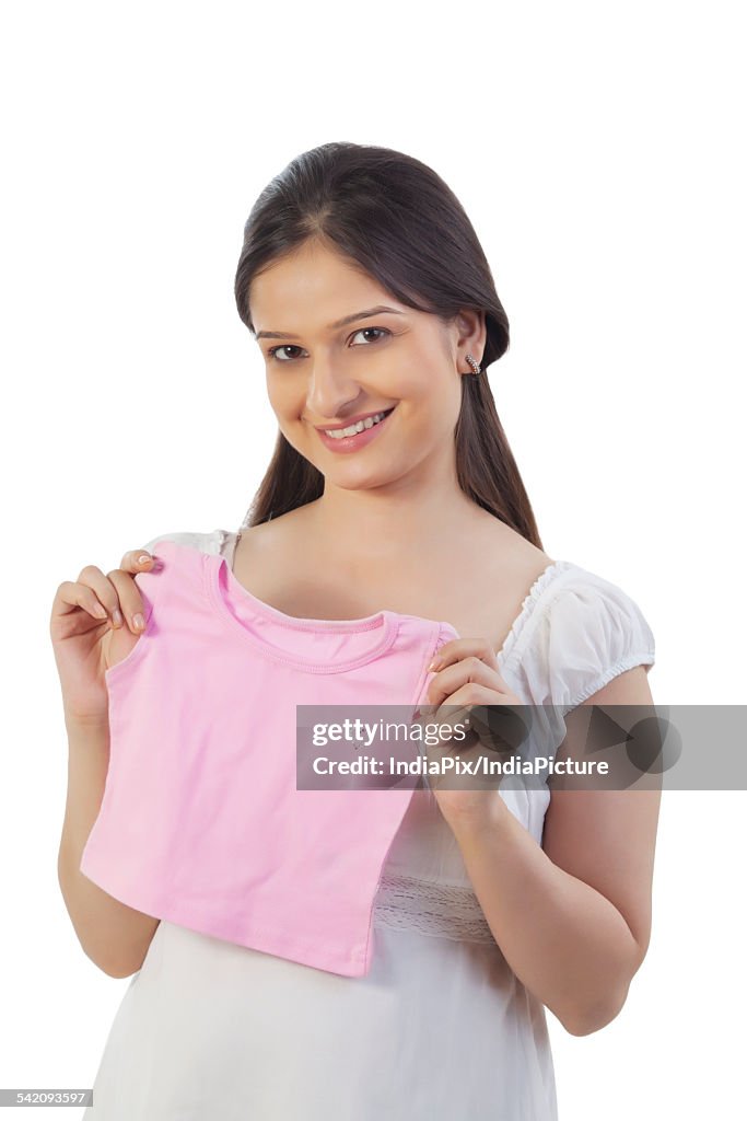 Pregnant woman holding a baby t-shirt