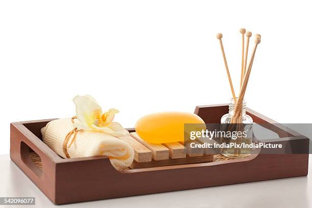 soap , bath scrub and reed diffuser in a tray - spa treatment ストックフォトと画像