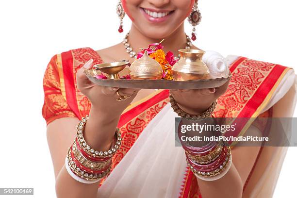 Shell Thali 156 Hand Holding Conch Shell Stock Photos, High-Res Pictures, and ...