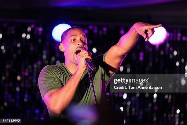 Will Smith joins Chris Martin of Coldplay on stage at a dinner party hosted by iHeartmedia and Medialink featuring a special performance by Chris...