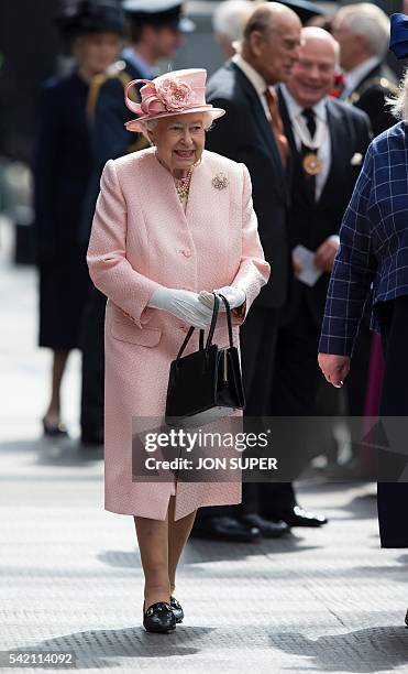 Britain's Queen Elizabeth II walks along the platform after arriving by Royal Train at Liverpool Lime Street Station in Liverpool, north-west England...