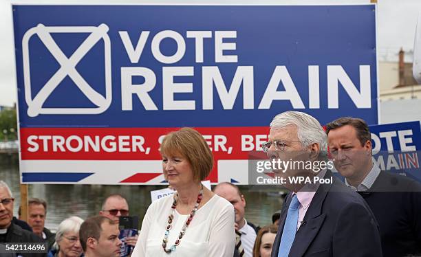 British Prime Minister David Cameron stands with Labour MP Harriet Harman as former Conservative Prime Minister Sir John Major addresses pro-EU "Vote...