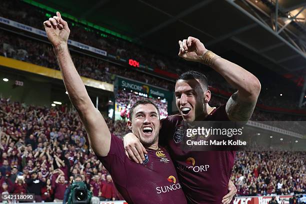 Corey Oates of the Maroons celebrates with his team mate Darius Boyd of the Maroons after scoring a try during game two of the State Of Origin series...