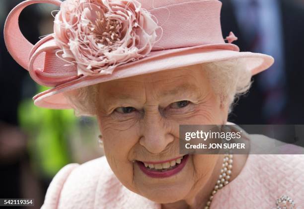 Britain's Queen Elizabeth II reacts after arriving by Royal Train at Liverpool Lime Street Station in Liverpool, north-west England on June 22, 2016....