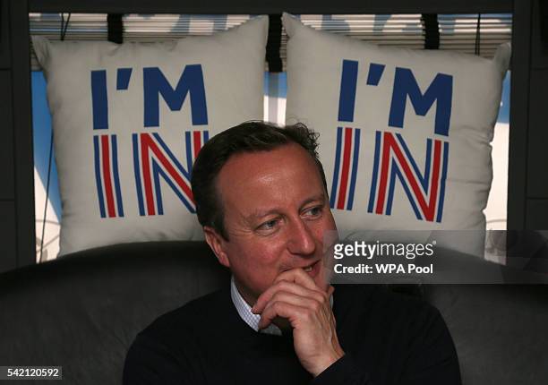 British Prime Minister David Cameron reacts as he travels on his campaign bus from Bristol on June 22, 2016 in Bristol, United Kingdom. The final day...