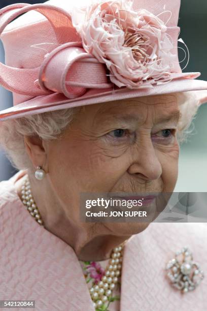 Britain's Queen Elizabeth II reacts after arriving by Royal Train at Liverpool Lime Street Station in Liverpool, north-west England on June 22, 2016....