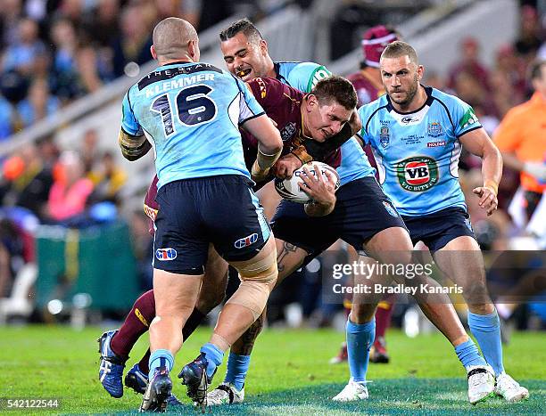 Jacob Lillyman of the Maroons takes on the defence during game two of the State Of Origin series between the Queensland Maroons and the New South...