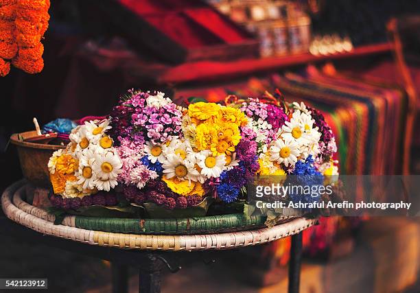 colourful flowers for offering at pashupatinath temple - pashupatinath stock pictures, royalty-free photos & images