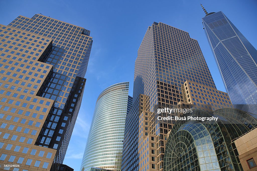 The World Financial Center in Lower Manhattan ( renamed Brookfield Place in 2014) with the One World Trade Center Tower in the background, at sunset