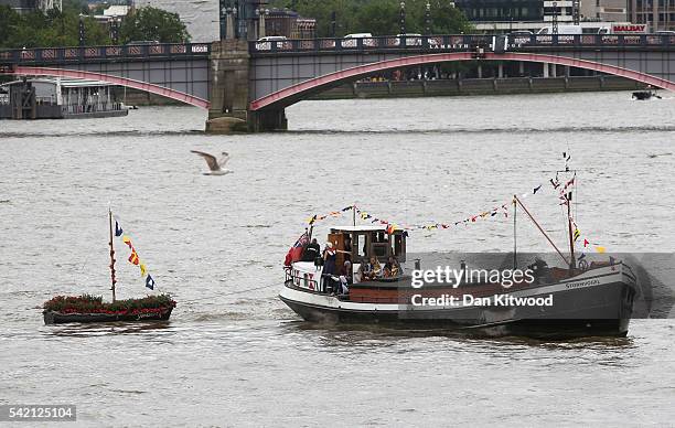 Brendan Cox, husband of murdered Labour MP Jo Cox, and their children ride on a boat towing a memorial dedicated to Jo Cox down the River Thames on...