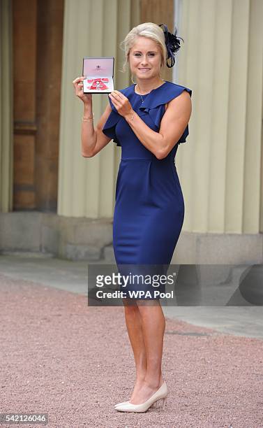 England Women footballer Stephanie Houghton poses after she received her Member of Order of the British Empire medal from the Princess Royal during...