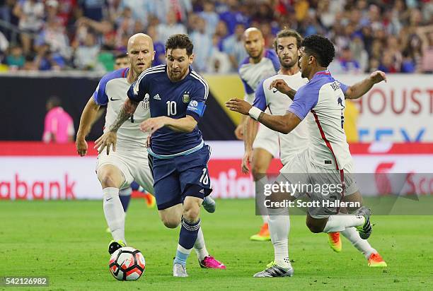 Lionel Messi of Argentina passes through a group of defenders in the first half against the United States during a 2016 Copa America Centenario...