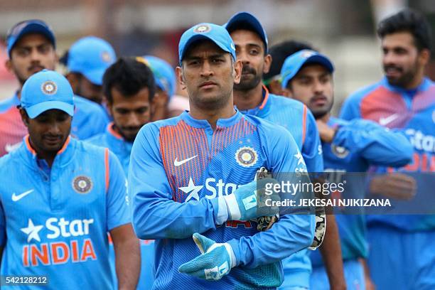India captain Mahendra Singh Dhoni leads his team after victory during the third and final T20 cricket match in a serie of three games between India...