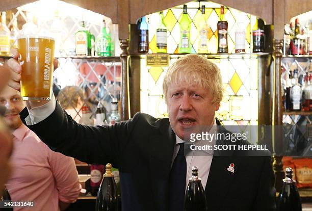 Former London Mayor, and "Vote Leave" campaigner, Boris Johnson is pictured with a pint of beer ahead of meeting with members of the public and...