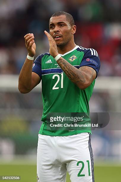 Josh Magennis of Northern Ireland applauds the supporters following the UEFA Euro 2016 Group C match between the Northern Ireland and Germany at Parc...