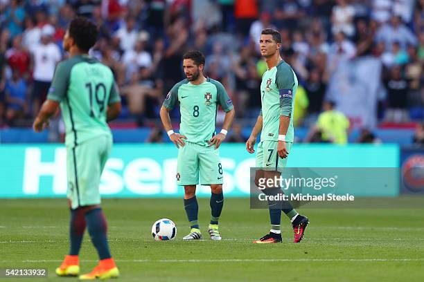Cristiano Ronaldo and Joao Moutinho of Portugal show their dejection after Hungary's first goal during the UEFA EURO 2016 Group F match between...