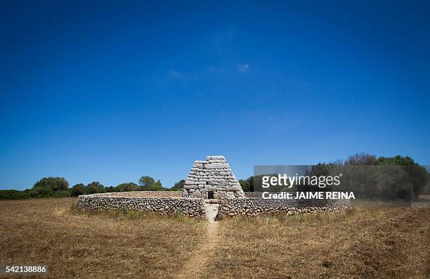 Picture taken on June 22, 2016 shows the Naveta des Tudons, a prehistoric monument near the Ciutadella on the island of Menorca. Human presence in...