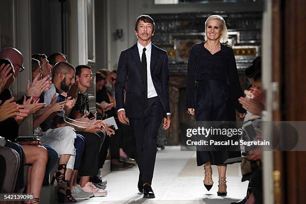 Designers Pierpaolo Piccioli and Maria Grazia Chiuri walk the runway during the Valentino Menswear Spring/Summer 2017 show as part of Paris Fashion...