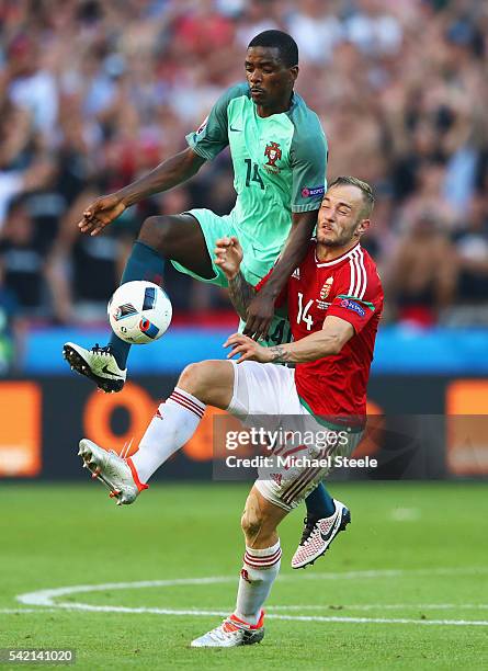 Gergo Lovrencsics of Hungary and William Carvalho of Portugal compete for the ball during the UEFA EURO 2016 Group F match between Hungary and...