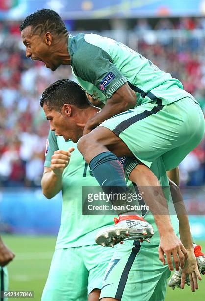 Cristiano Ronaldo of Portugal celebrates his last goal with Nani and teammates during the UEFA EURO 2016 Group F match between Hungary and Portugal...