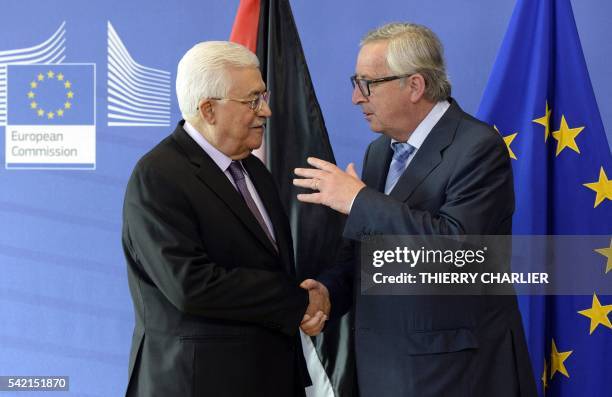 President of the Palestinian National Authority Mahmud Abbas shakes hands with President of the European Union Commission Jean-Claude Juncker prior...