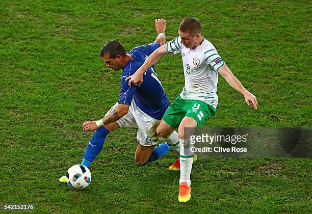 Stefano Sturaro of Italy controls the ball under pressure of James McCarthy of Republic of Ireland during the UEFA EURO 2016 Group E match between...