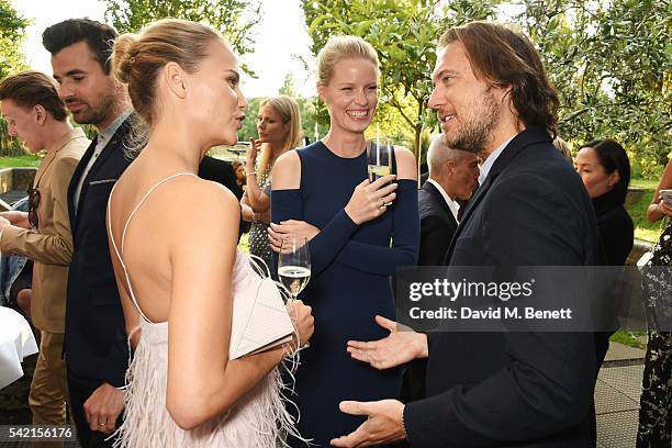 Natasha Poly, Caroline Winberg and Lance LePere attend a private dinner hosted by Michael Kors to celebrate the new Regent Street Flagship store...